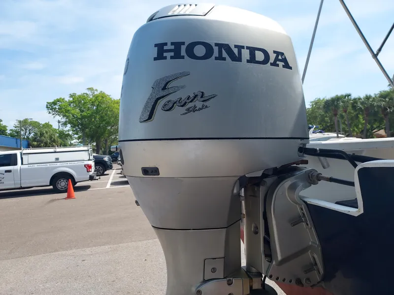 Slide: The Image of Honda Four Stroke outboard motor on a 2000 Eastern 19 Center Console boat. - 31