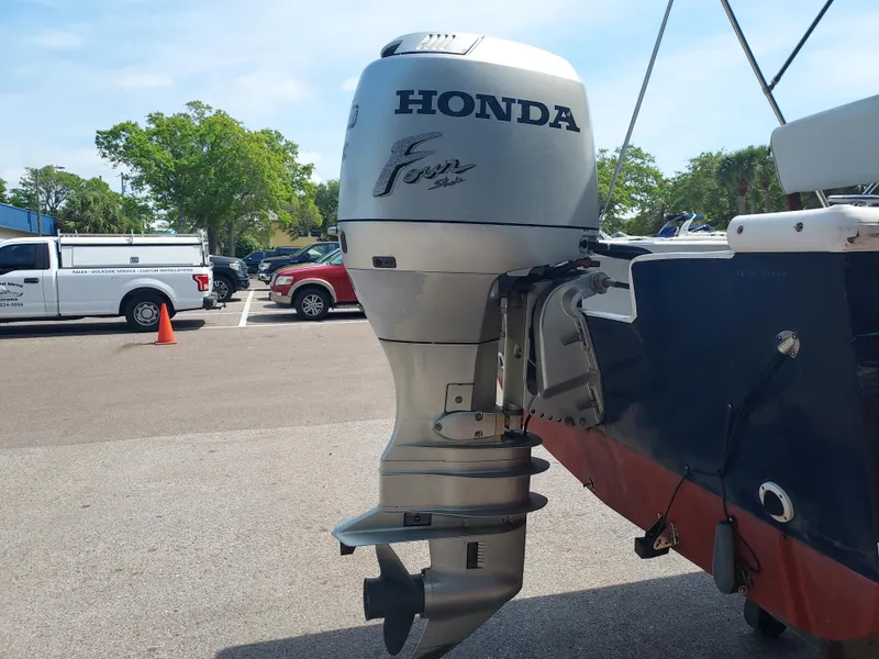 Slide: The Image of 2000 Eastern 19 Center Console with Honda outboard motor in parking lot. - 33