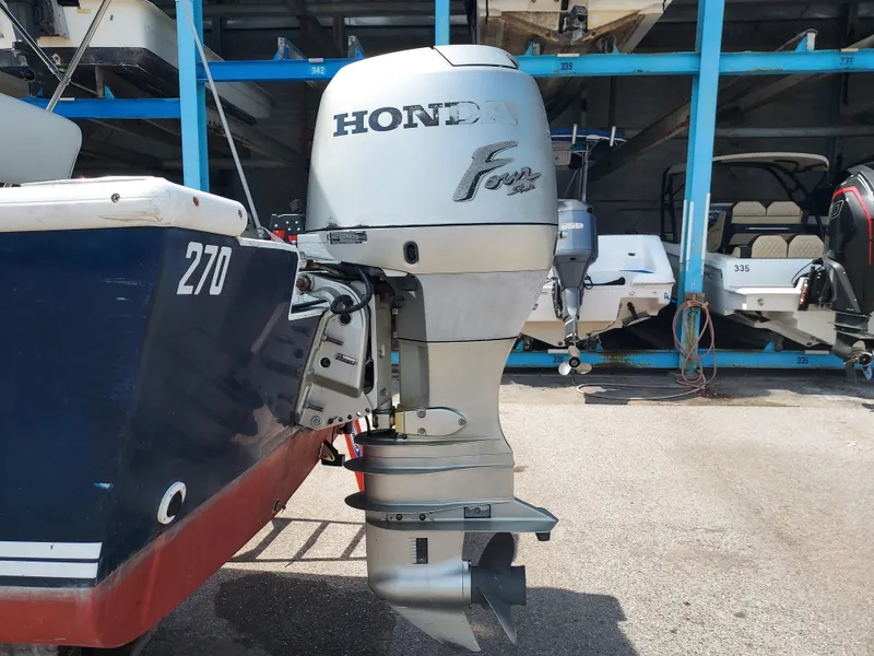 Slide: The Image of Eastern 19 Center Console 2000 boat with Honda Four Stroke outboard motor. - 34