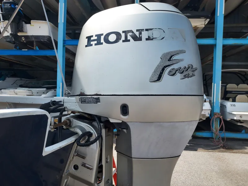 Slide: The Image of Honda Four Stroke outboard motor on a 2000 Eastern 19 Center Console boat. - 35