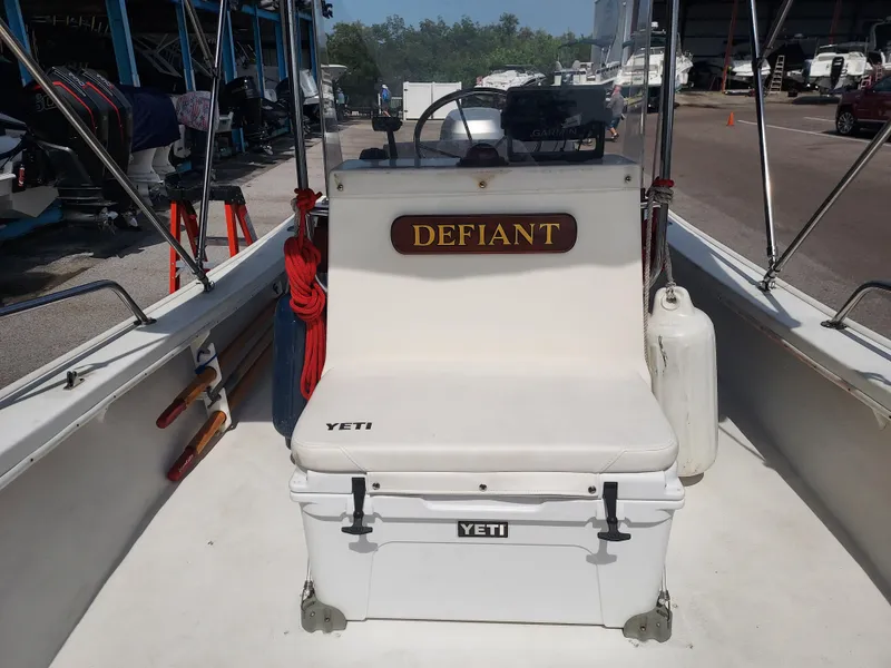 Slide: The Image of Eastern 19 Center Console boat, 2000 model, with Defiant nameplate and Yeti cooler on deck. - 40