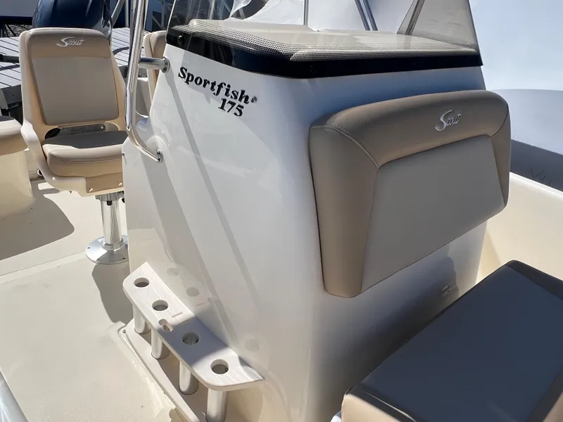 Slide: The Image of 2024 Scout 175 Sportfish boat interior with seating and rod holders. - 12