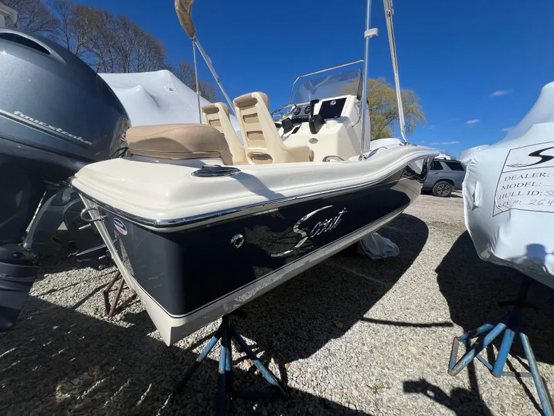 Slide: The Image of 2024 Scout 175 Sportfish boat on display, side view, outdoors. - 3