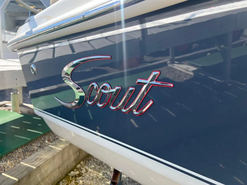 Slide: The Image of 2024 Scout 175 Sportfish boat logo in sunlight. - 8