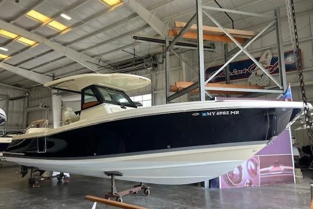 The Image of 2020 Chris-Craft Catalina 30 boat in a storage facility. - 0