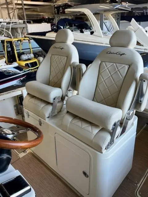 Slide: The Image of Luxurious 2020 Chris-Craft Catalina 30 helm seats with diamond-stitched upholstery. - 14