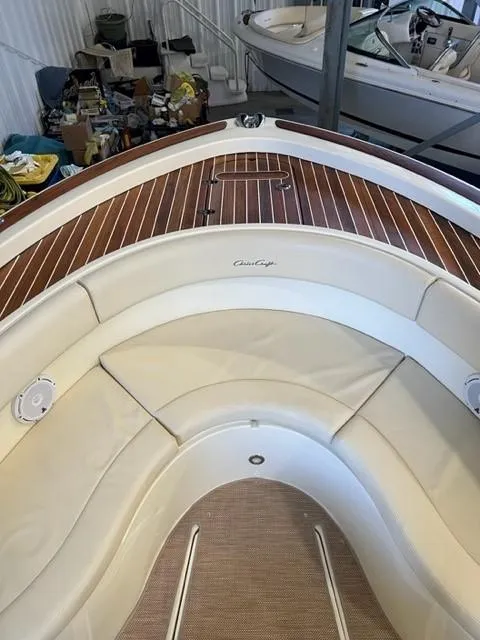 Slide: The Image of 2020 Chris-Craft Catalina 30 boat interior with teak deck and cushioned seating. - 16