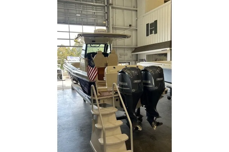 Slide: The Image of 2020 Chris-Craft Catalina 30 boat with twin Yamaha 300 engines in a showroom. - 2