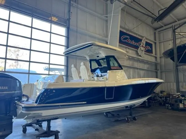 Slide: The Image of 2020 Chris-Craft Catalina 30 boat in a showroom, side view. - 3