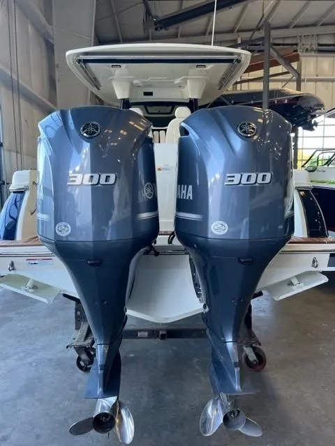 Slide: The Image of 2020 Chris-Craft Catalina 30 with twin Yamaha 300 outboard engines in a boat garage. - 7