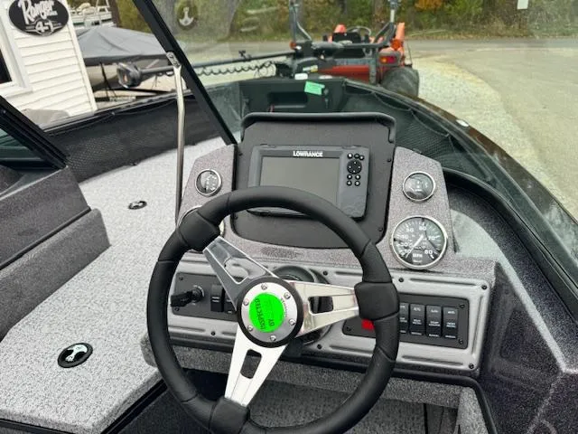 Slide: The Image of 2024 Ranger VS1882WT boat dashboard with steering wheel and Lowrance fishfinder. - 5