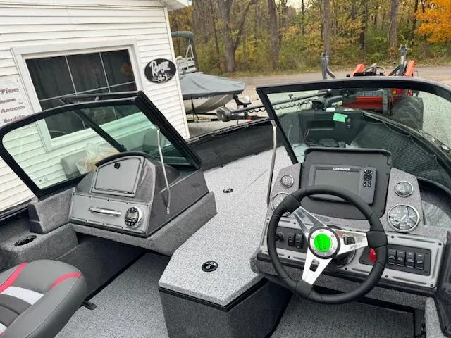 Slide: The Image of 2024 Ranger VS1882WT boat interior with steering console and seating. - 6