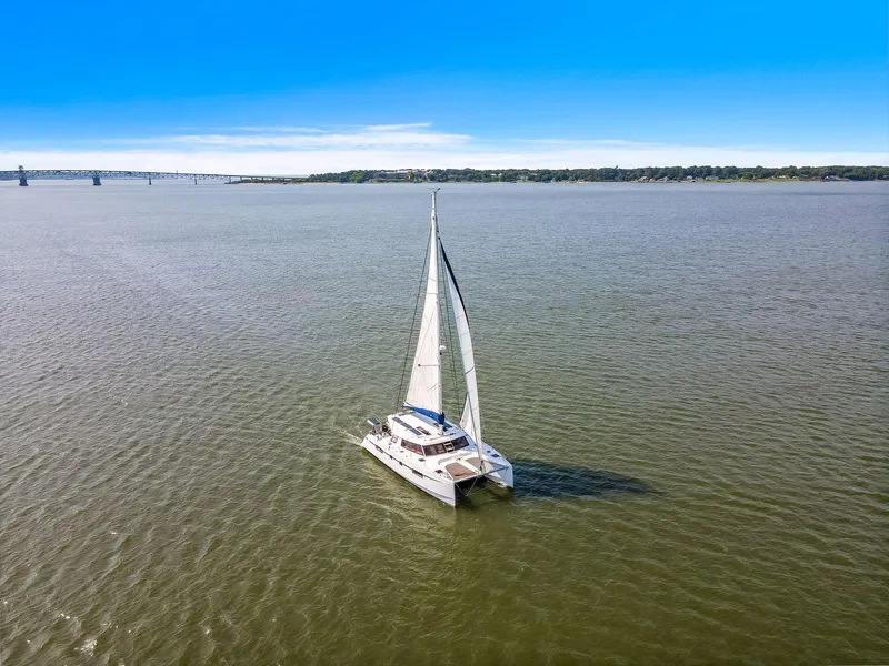 Slide: The Image of Sailing catamaran Nautitech 46 Open 2017 on open water under clear blue sky. - 11