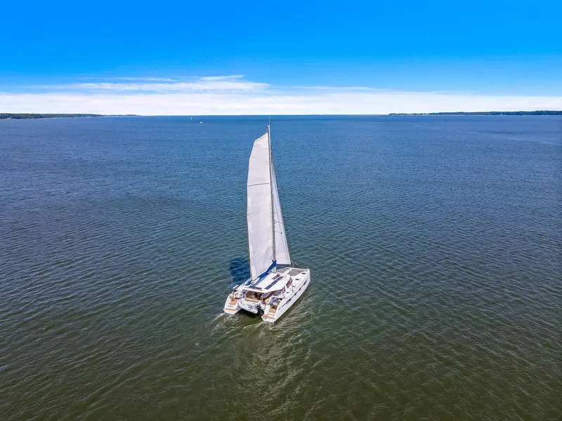 Slide: The Image of Sailing catamaran Nautitech 46 Open 2017 on open sea under clear blue sky. - 14