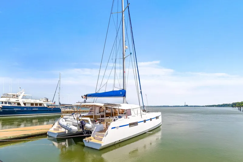 Slide: The Image of 2017 Nautitech 46 Open catamaran docked in serene marina setting. - 23