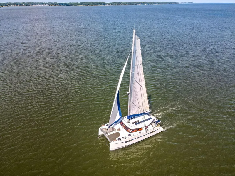 Slide: The Image of Aerial view of 2017 Nautitech 46 Open catamaran sailing on open water. - 3