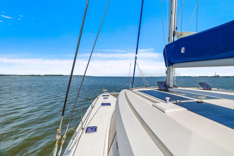 Slide: The Image of Sailing on a 2017 Nautitech 46 Open catamaran, clear blue skies, and calm waters. - 34