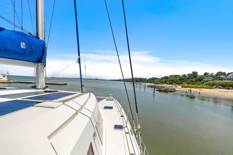 Slide: The Image of Nautitech 46 Open sailing near a scenic coastline, 2017 model. - 35