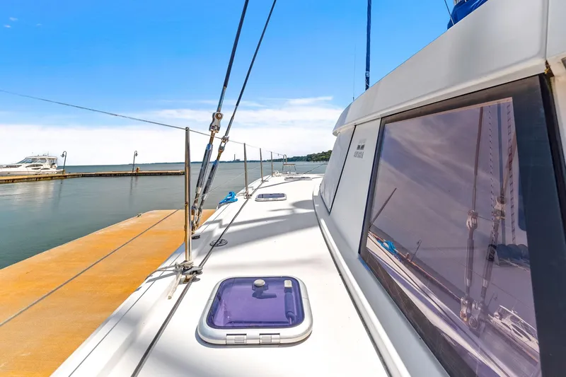 Slide: The Image of 2017 Nautitech 46 Open catamaran docked at a marina under clear blue skies. - 37