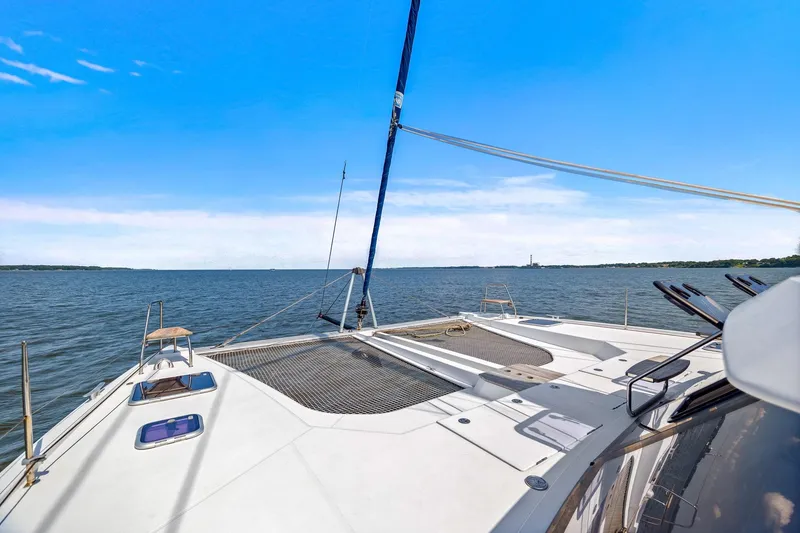 Slide: The Image of 2017 Nautitech 46 Open catamaran sailing on open water under clear blue skies. - 39