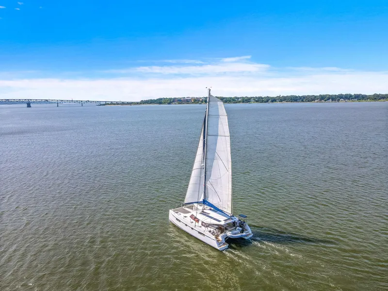 Slide: The Image of Sailing catamaran Nautitech 46 Open, 2017 model, cruising on open water under clear blue skies. - 4