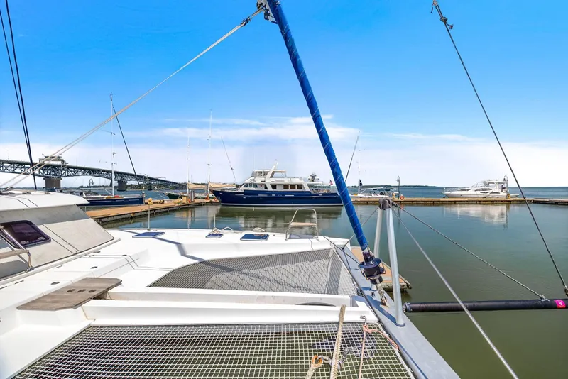 Slide: The Image of Nautitech 46 Open catamaran docked in a marina, 2017 model, with clear blue sky. - 42