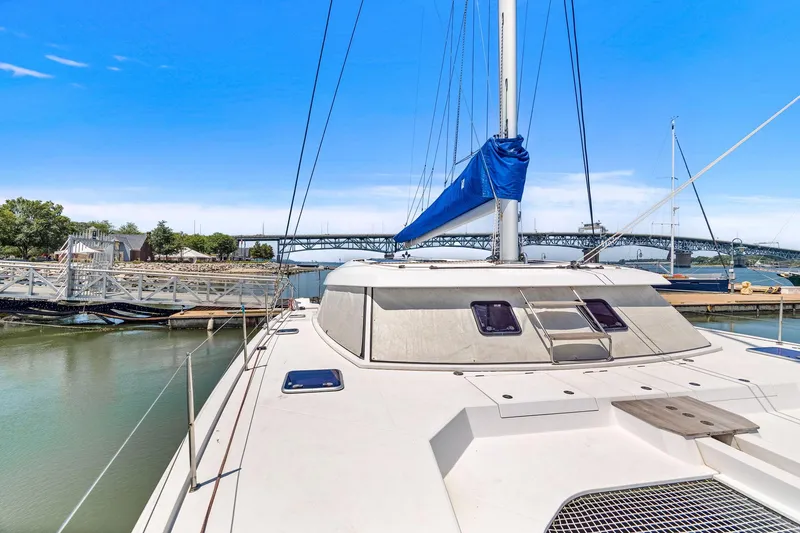 Slide: The Image of 2017 Nautitech 46 Open catamaran docked, featuring sleek design and spacious deck. - 44