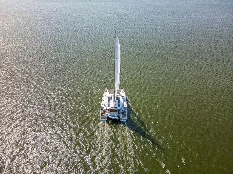 Slide: The Image of Aerial view of 2017 Nautitech 46 Open catamaran sailing on calm waters. - 5