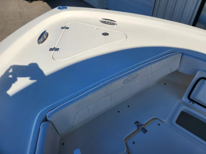Slide: The Image of 2024 Pair Customs 27 CC boat with luxurious white seating and dual outboard engines. - 15