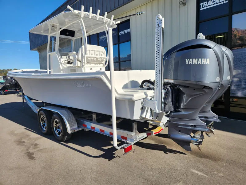 Slide: The Image of 2024 Pair Customs 27 CC boat with dual Yamaha 250 V6 engines on a trailer. - 5