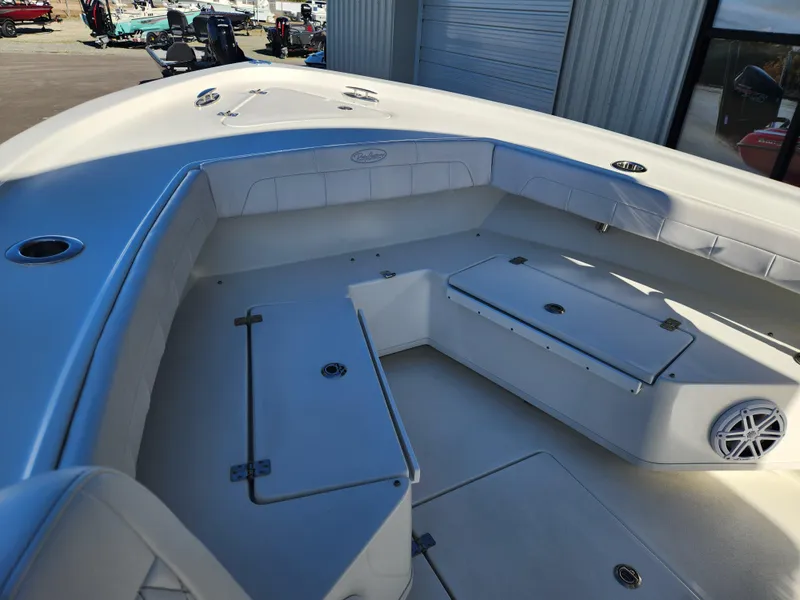 Slide: The Image of 2024 Pair Customs 27 CC boat dashboard with Garmin displays and steering wheel. - 11