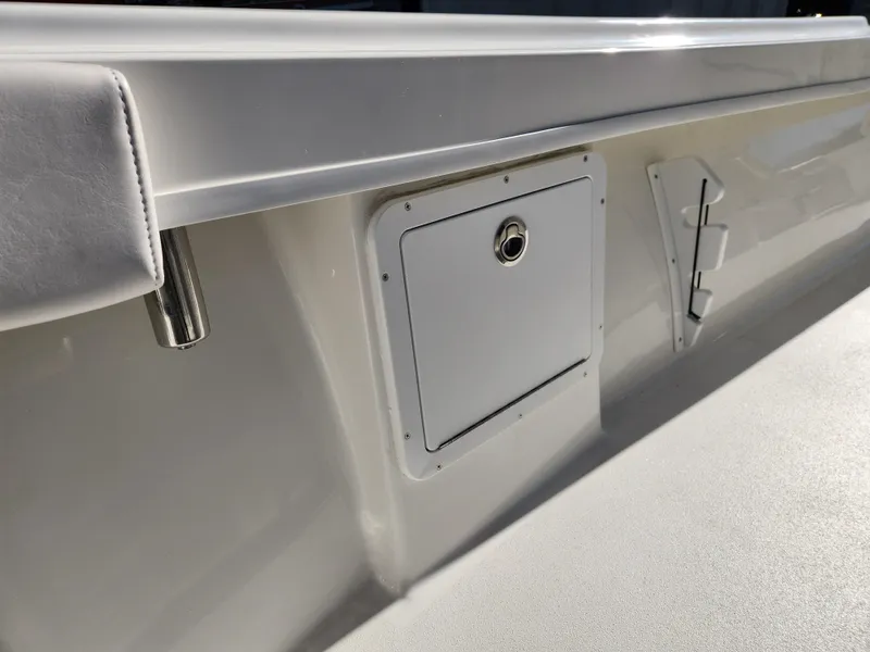 Slide: The Image of 2024 Pair Customs 27 CC boat with sleek metal antenna against a clear sky. - 17