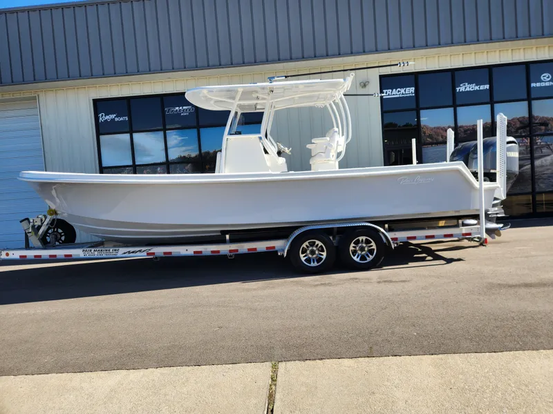 Slide: The Image of 2024 Pair Customs 27 CC boat with dual Yamaha 250 V6 engines on a trailer. - 3