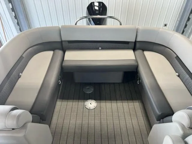 Slide: The Image of 2023 Godfrey SWEETWATER 2286 SB boat interior with gray seating and flooring. - 5