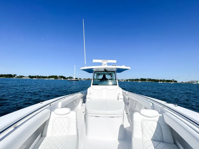 Slide: The Image of 2025 HCB 39 Speciale boat on open water under clear blue sky. - 5