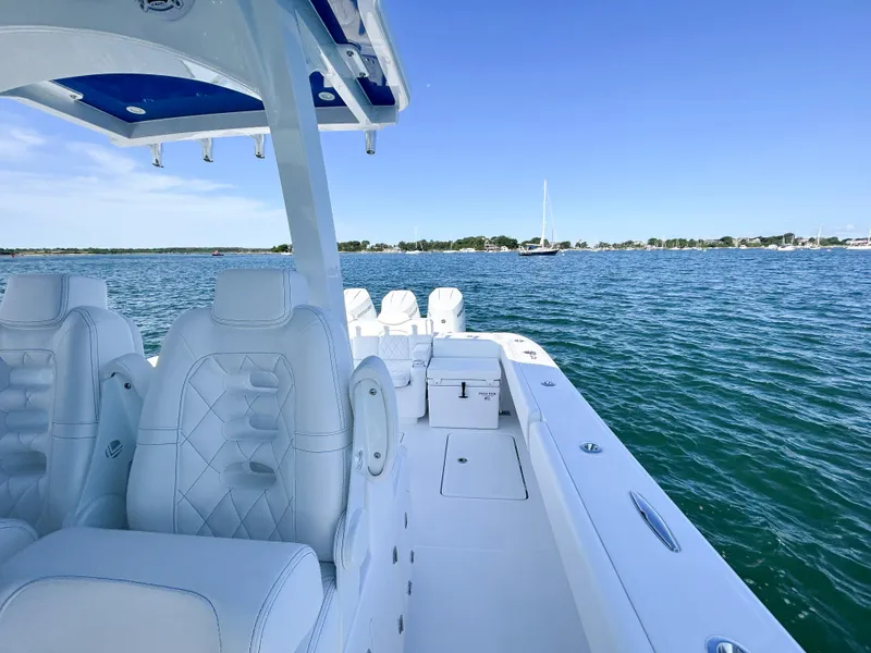 Slide: The Image of 2025 HCB 39 Speciale luxury boat interior on a serene lake. - 7