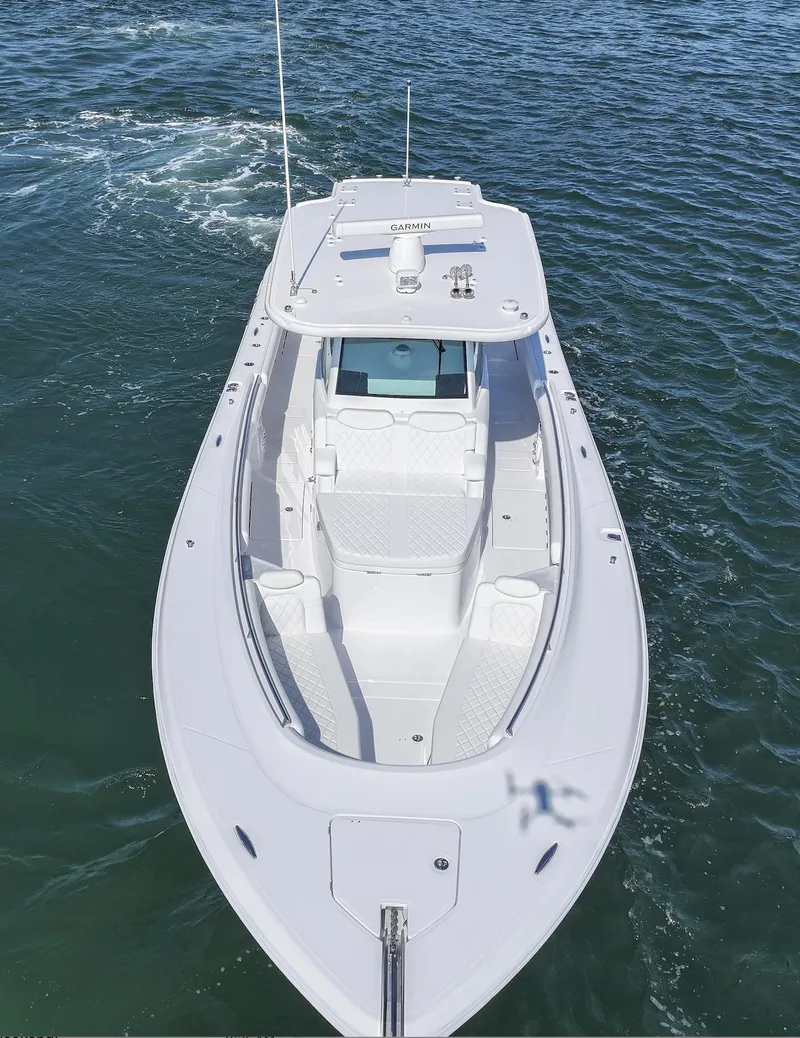 Slide: The Image of 2025 HCB 39 Speciale boat cruising on open water. - 8