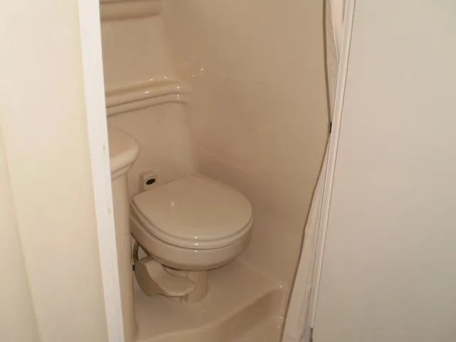 Slide: The Image of Compact bathroom in 2005 Sea Ray 260 Sundancer boat. - 10