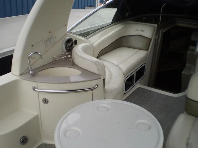 Slide: The Image of Interior of 2005 Sea Ray 260 Sundancer boat with seating and kitchenette. - 7