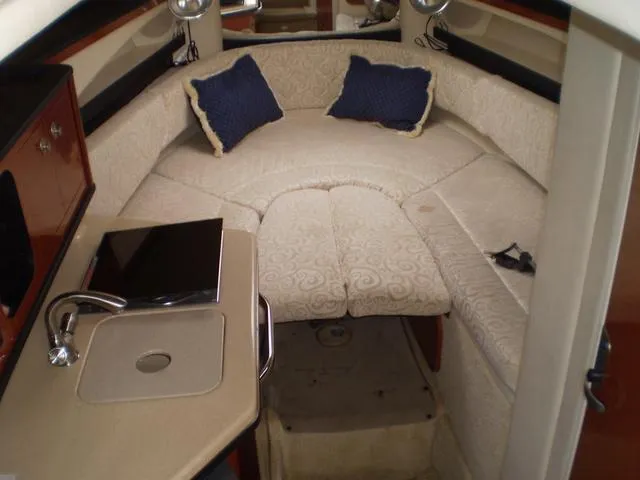 Slide: The Image of Interior cabin of a 2005 Sea Ray 260 Sundancer with seating and kitchenette. - 8