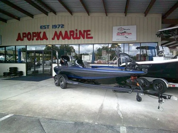 Slide: The Image of 2024 Skeeter ZXR20 boat displayed outside Apopka Marine dealership. - 11