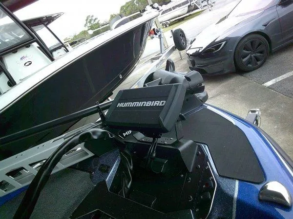 Slide: The Image of 2024 Skeeter ZXR20 boat with Humminbird fish finder at a marina. - 4