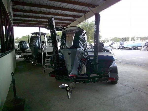 Slide: The Image of 2024 Skeeter ZXR20 boat in a covered storage area. - 8