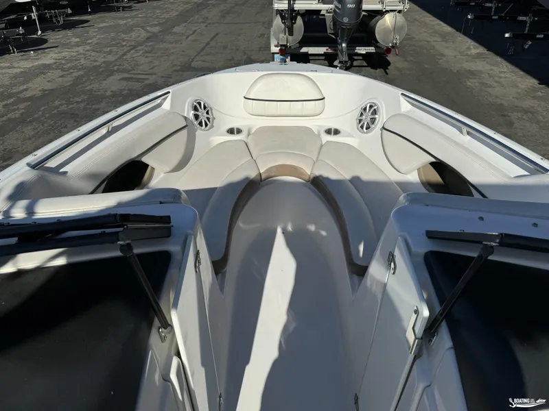 Slide: The Image of 2008 Four Winns Horizon 220SS boat interior with white seating and speakers. - 10