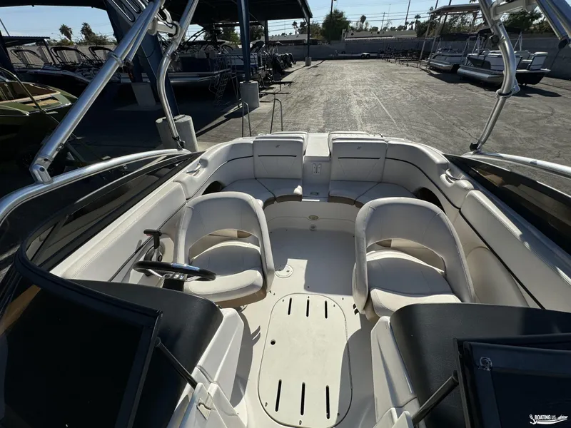 Slide: The Image of 2008 Four Winns Horizon 220SS boat interior with white seating and steering wheel. - 11