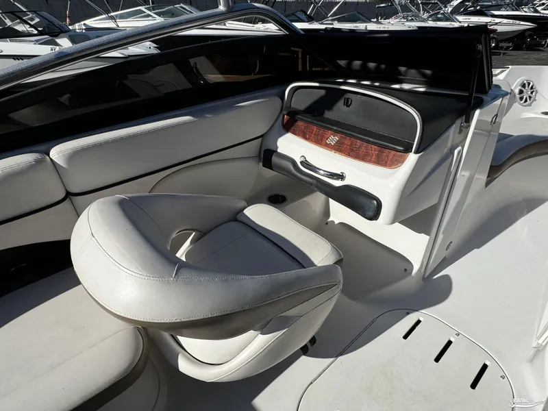 Slide: The Image of 2008 Four Winns Horizon 220SS boat interior with white seating and sleek dashboard design. - 13