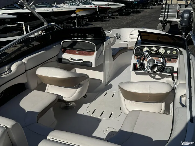 Slide: The Image of 2008 Four Winns Horizon 220SS boat interior with white seating and dashboard. - 15