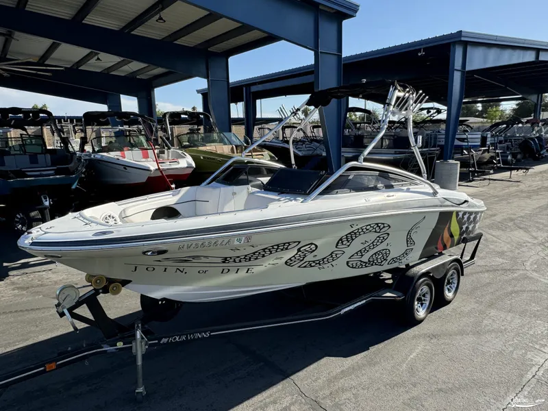 Slide: The Image of 2008 Four Winns Horizon 220SS boat with custom "Join or Die" graphics on trailer. - 2