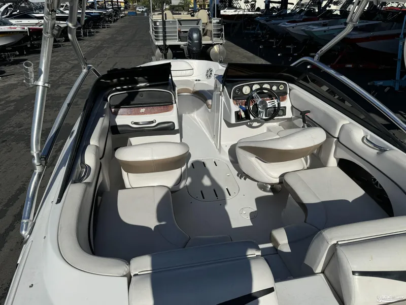 Slide: The Image of 2008 Four Winns Horizon 220SS boat interior with white seating and steering console. - 8