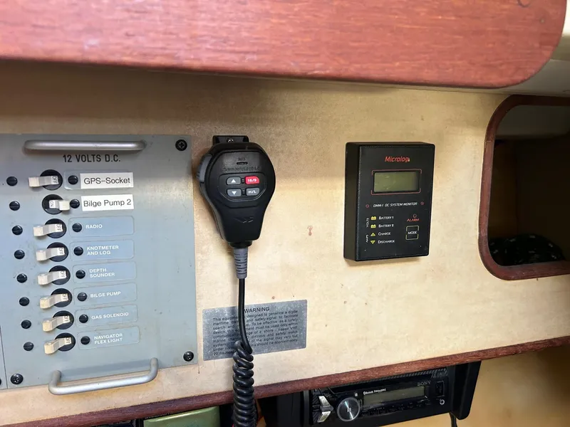 Slide: The Image of Control panel and communication equipment on a 1981 C&C 32 CB sailboat. - 25